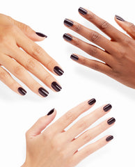 Three hands display glossy deep plum OPI Lincoln Park After Dark xPRESS/ON press-on nails, a dramatic short manicure shade for fall nail colors on a clean white background.