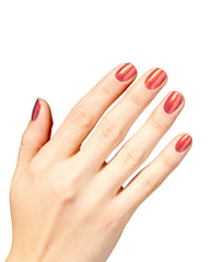 Hand with neatly manicured nails painted in Liquid Fire nail lacquer, a metallic coral-red OPI nail polish with golden shimmer, displayed against a clean white background to showcase the vibrant, glossy finish.