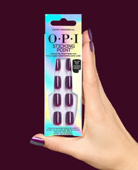 OPI Sticking Point Louvre Conquers All press-on nails in shimmery deep plum packaging held by a hand with matching manicure against a dark burgundy background, ideal for fall nail colors.