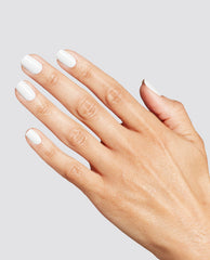 Hand with neatly manicured short nails painted in glossy opaque white, showcasing the OPI Love at Frost Sight RapiDry nail polish gift set finish against a clean light gray background.