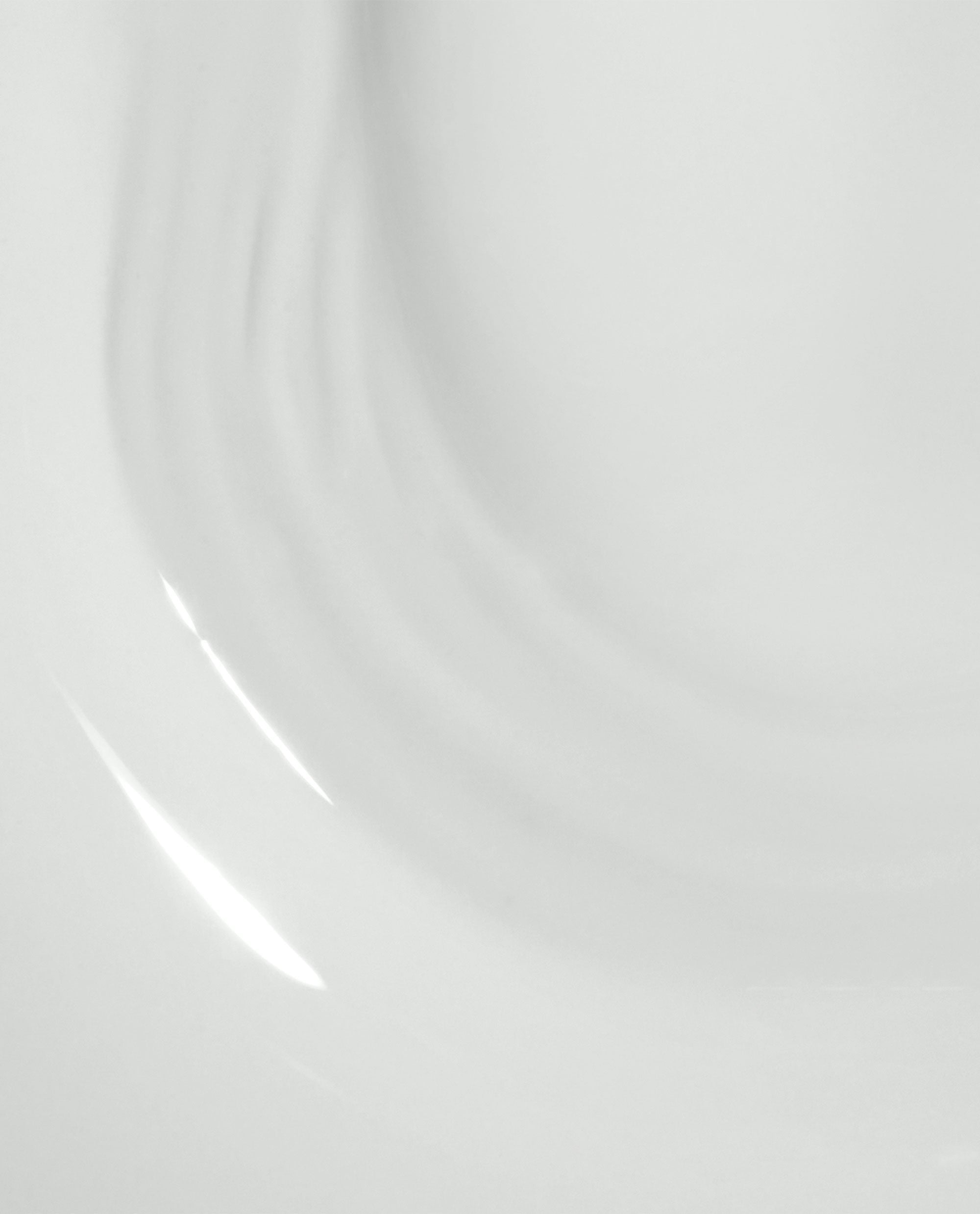 Glossy white OPI Love at Frost Sight RapiDry nail lacquer swatch flowing in soft curved streaks on a clean background, highlighting the frosty shine ideal for an OPI nail polish gift set.