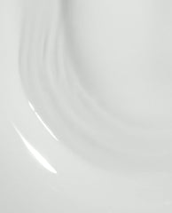 Glossy white OPI Love at Frost Sight RapiDry nail lacquer swatch flowing in soft curved streaks on a clean background, highlighting the frosty shine ideal for an OPI nail polish gift set.