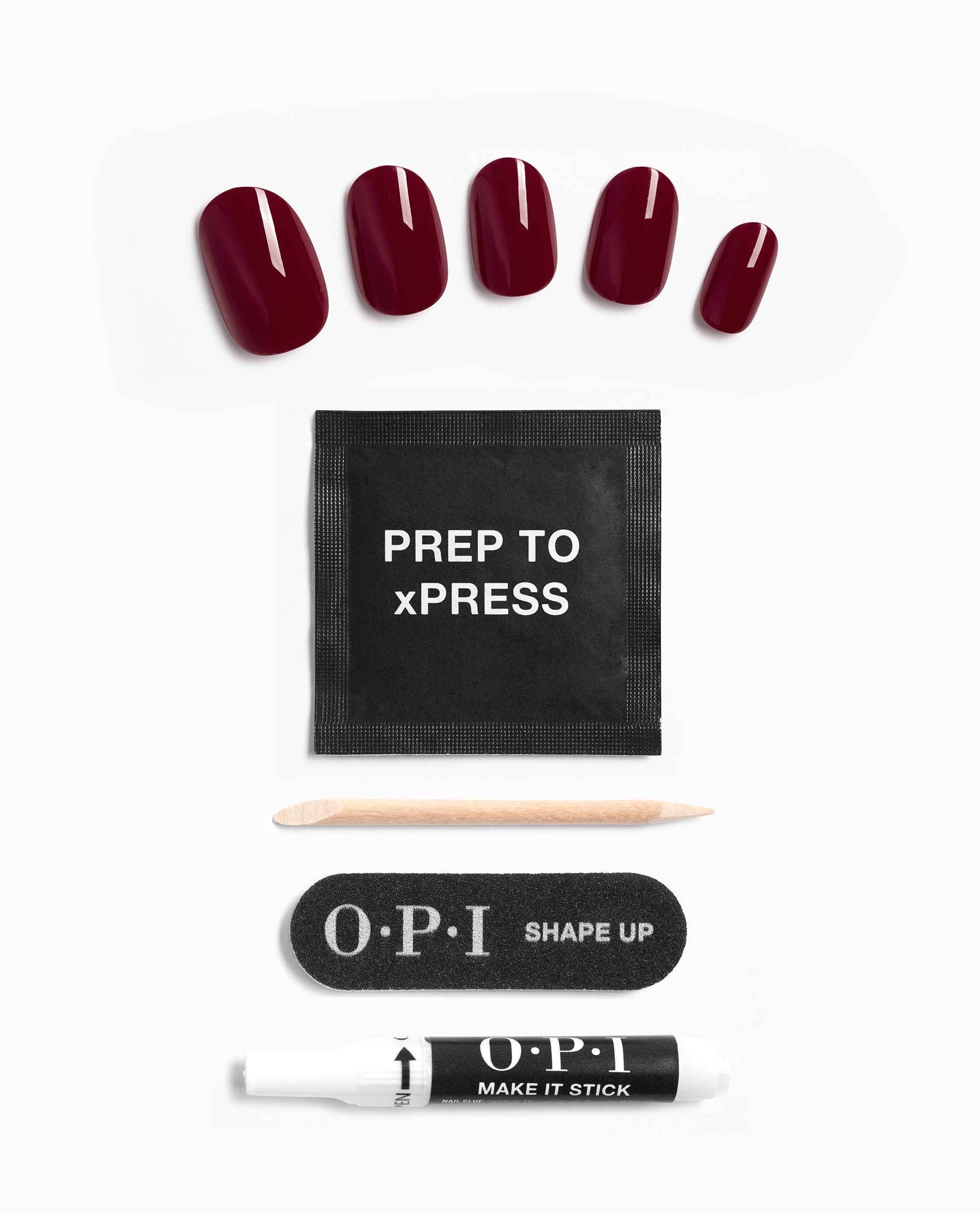 OPI xPRESS/ON Malaga Wine press-on nails in glossy deep burgundy are arranged with prep pad, cuticle stick, nail file, and glue, showcasing rich fall nail colors on a white background.
