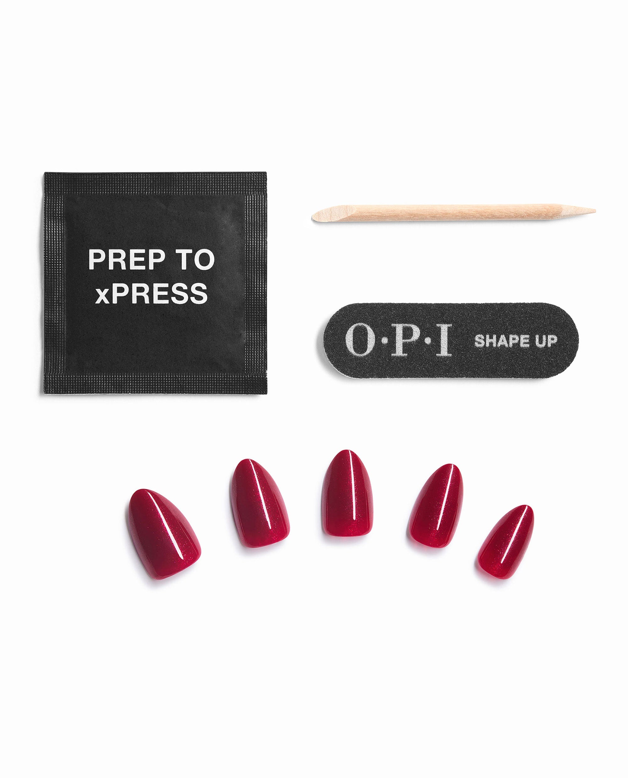 OPI Malaga Wine Not Sticking Point kit contents with glossy deep red press-on nails, prep pad, wooden cuticle stick, and black OPI nail file, a rich choice for fall nail colors.