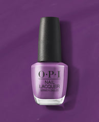 OPI nail polish bottle in Medi-take It All In, a creamy medium lavender nail lacquer, standing upright with a black textured cap against a matching purple background for a bold manicure look.