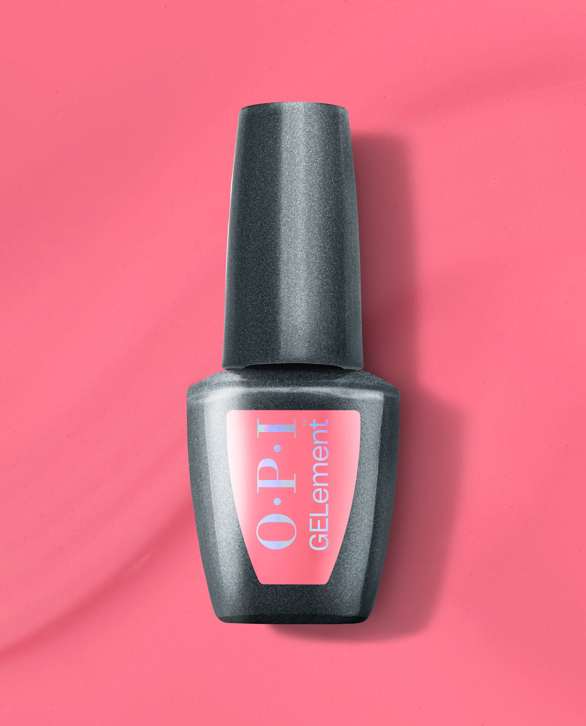 OPI MVPink at-home gel nail polish bottle standing upright, featuring a bright pink GELElement label on a sleek charcoal gray bottle, set against a matching vivid pink background, ideal for an OPI nail polish gift set.