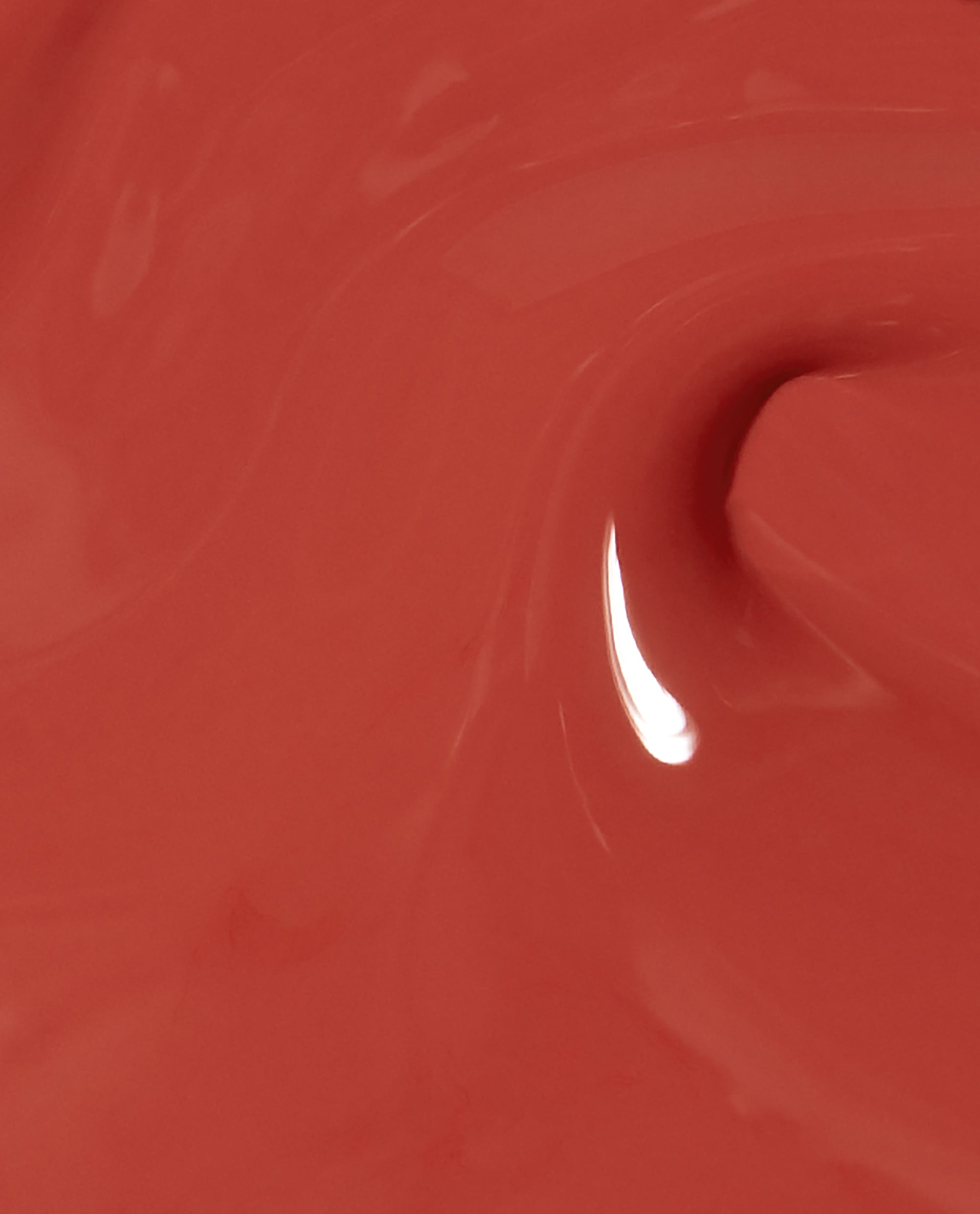 Close-up of OPI nail polish My Solar Clock is Ticking nail lacquer, showing a glossy, smooth swirl of warm terracotta coral color with a bright reflection highlighting its creamy, high-shine finish.