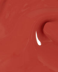 Close-up of OPI nail polish My Solar Clock is Ticking nail lacquer, showing a glossy, smooth swirl of warm terracotta coral color with a bright reflection highlighting its creamy, high-shine finish.