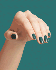 Hand with neatly manicured nails painted in My Studio's on Spring, a rich teal OPI nail polish, gracefully posed against a matching teal background to showcase the glossy nail lacquer color and shine.