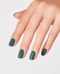 Hand with medium-length nails painted in My Studio's on Spring, a deep teal OPI nail polish nail lacquer, shown against a clean white background to highlight the glossy, opaque finish and smooth manicure look.