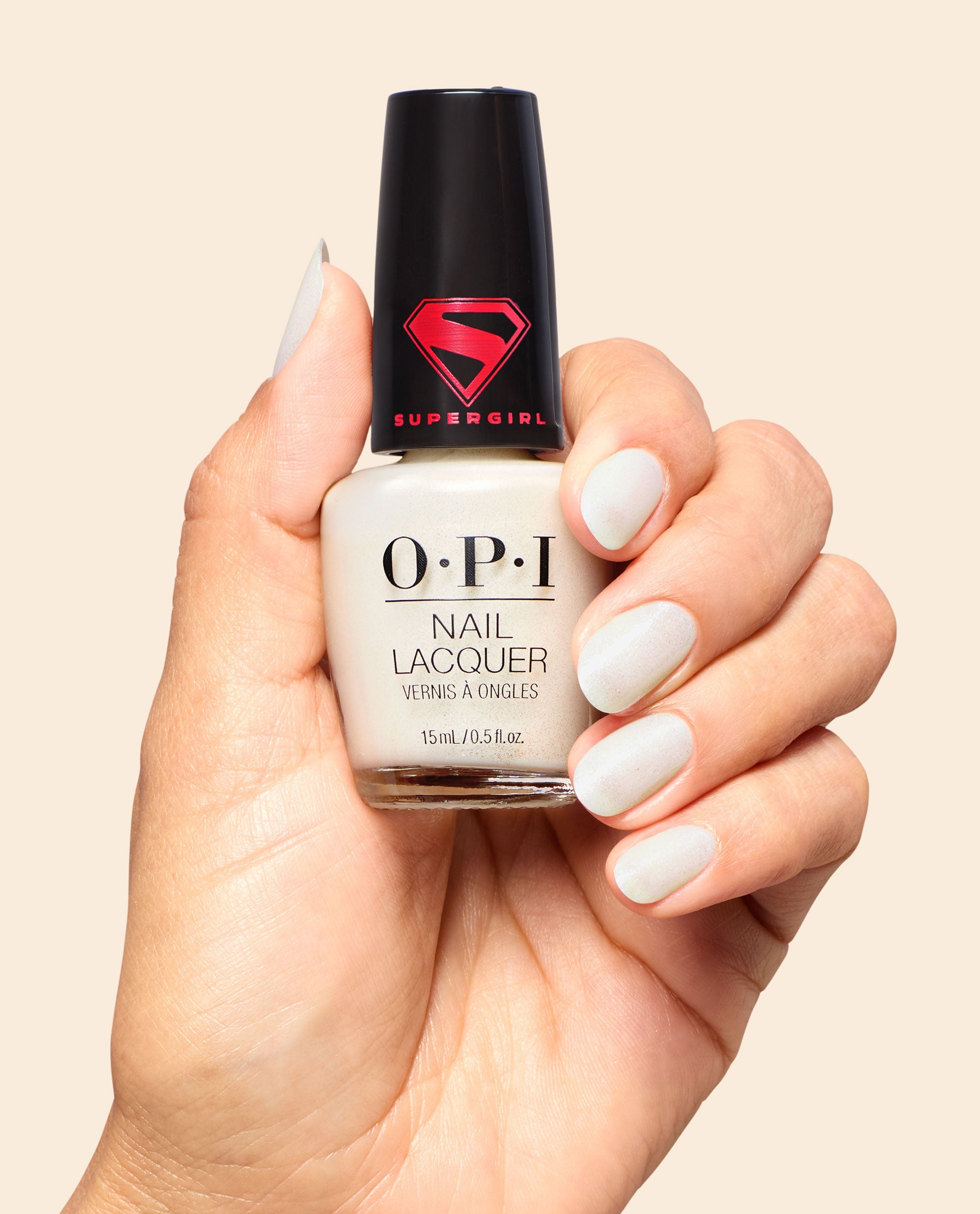 My Kryptonite Pearly White Shimmer Nail Polish Hand and Bottle