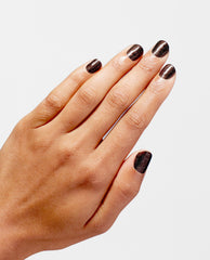 Hand modeling OPI Infinite Shine My Private Jet, a trending dark espresso-brown shimmer manicure with glossy short rounded nails on a clean white background.