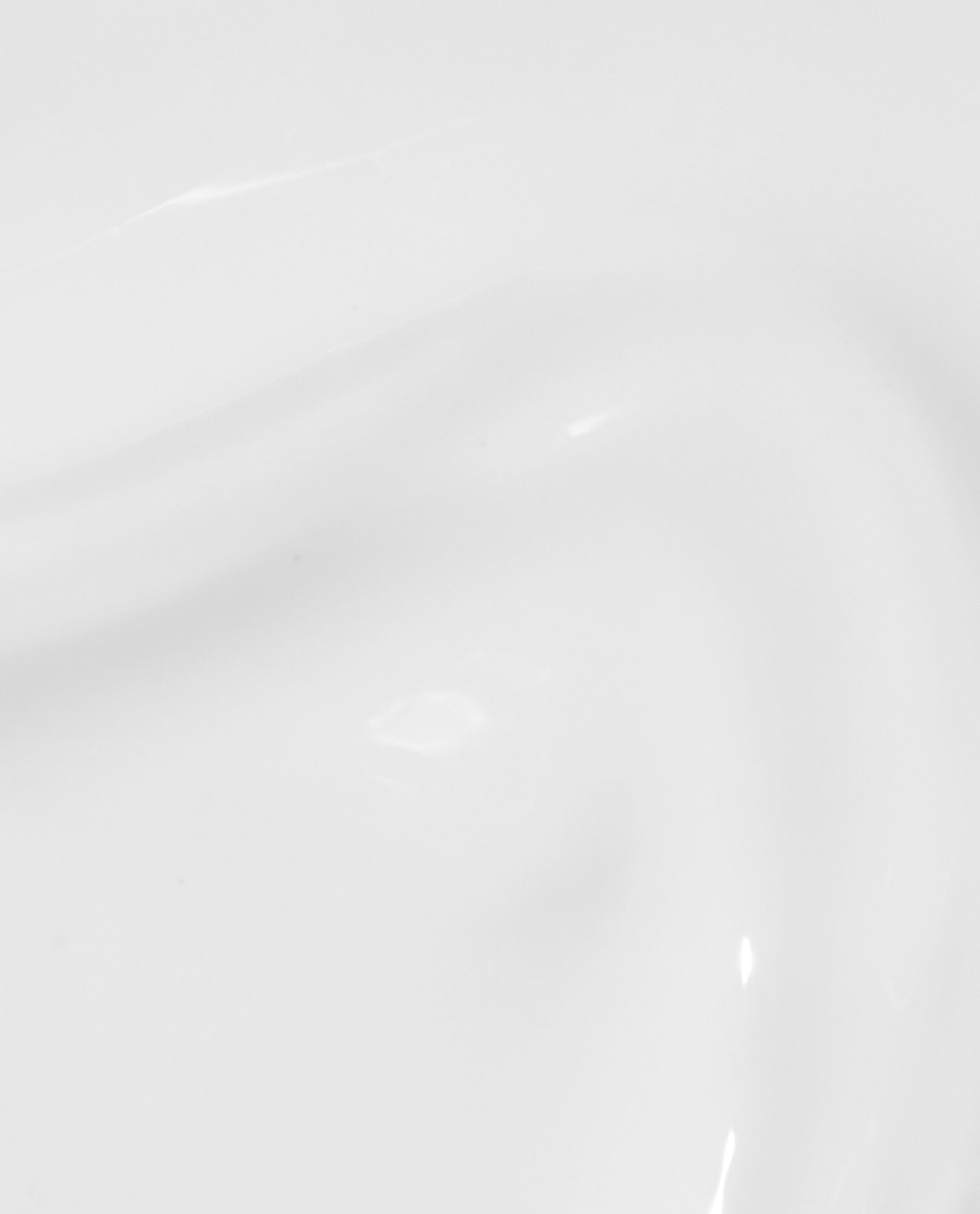 Glossy opaque white swatch of OPI Nail Envy Alpine Snow Nail Strengthener, showing a smooth trending nail treatment finish on a close-up white surface.