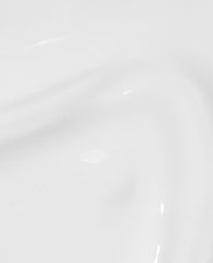 Glossy opaque white swatch of OPI Nail Envy Alpine Snow Nail Strengthener, showing a smooth trending nail treatment finish on a close-up white surface.