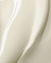 Close-up swatch of OPI Nail Envy® Nail Strengthener showing a smooth, glossy ivory-beige treatment formula, highlighting its creamy texture and shine for use alone or in an OPI nail polish gift set.