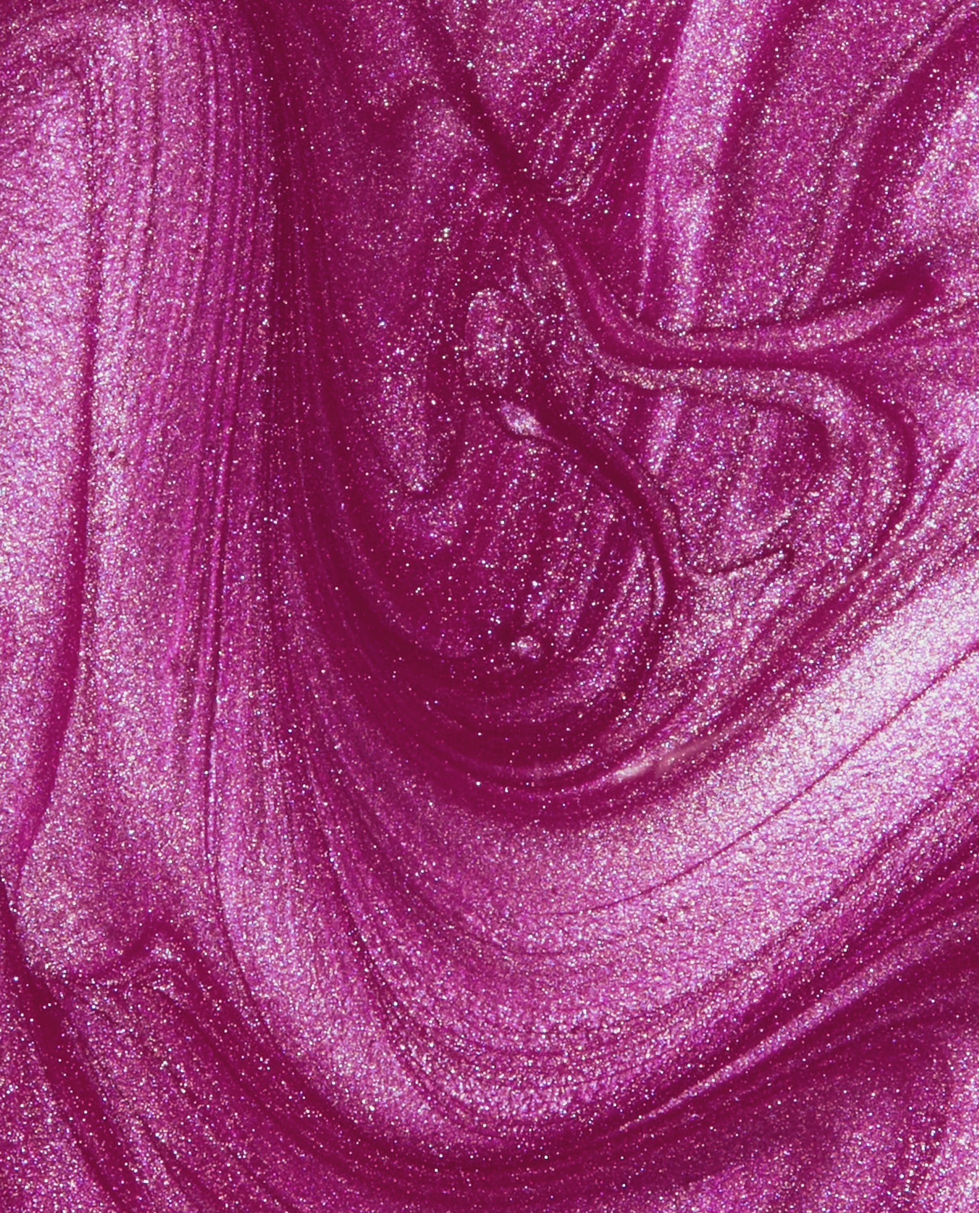 OPI Nail Envy Powerful Pink nail strengthener shimmers in a trending metallic fuchsia swatch, showing glossy brush strokes and fine sparkle in a close-up texture.