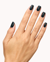 Hand displaying glossy deep black OPI Infinite Shine manicure in Nein! Nein! Nein! OK Fine!, a dramatic shade for fall nail colors, against a clean white background.