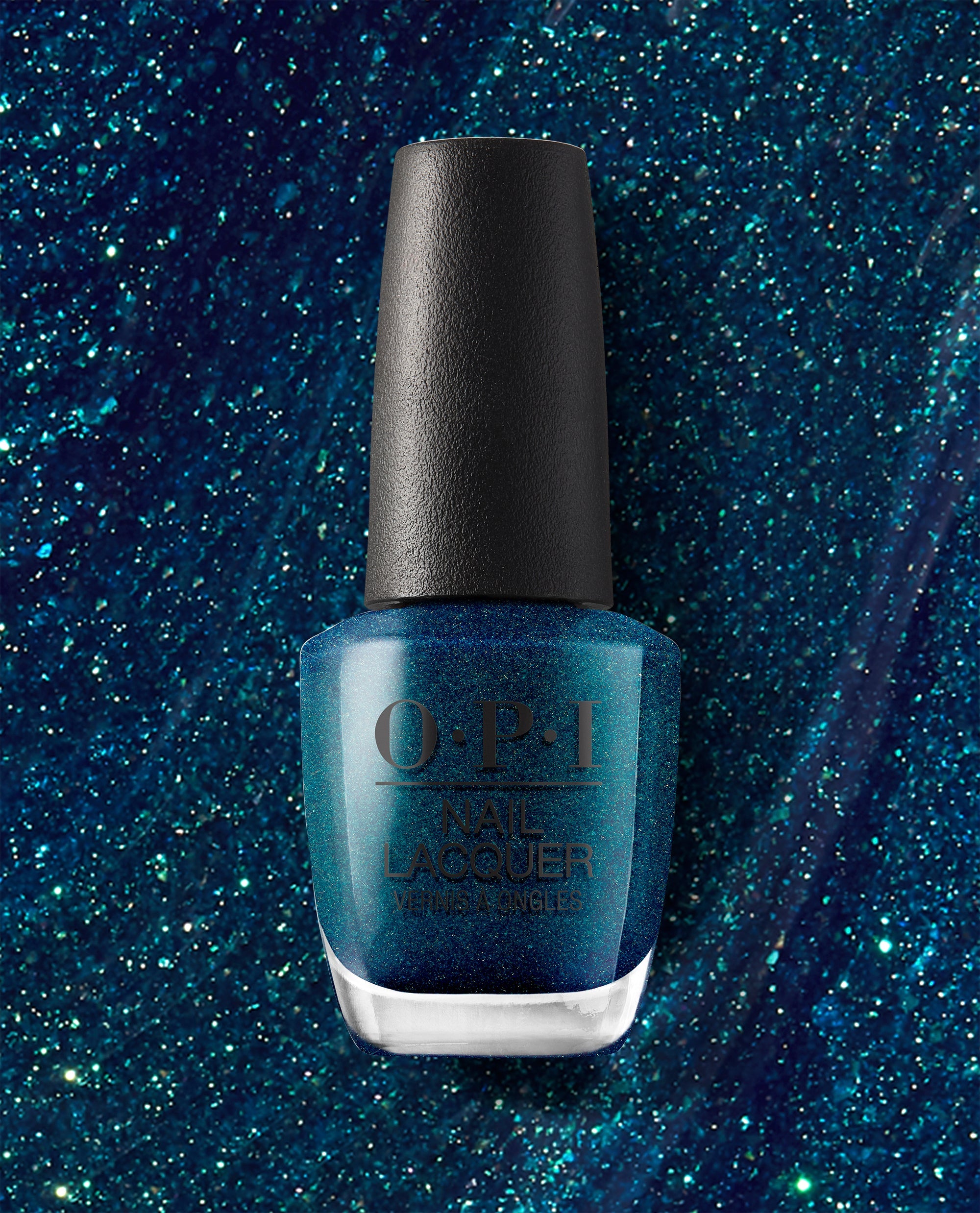 OPI nail polish bottle of Nessie Plays Hide & Sea-k nail lacquer standing upright, showcasing a deep teal-blue glitter shade against a matching sparkling blue background.
