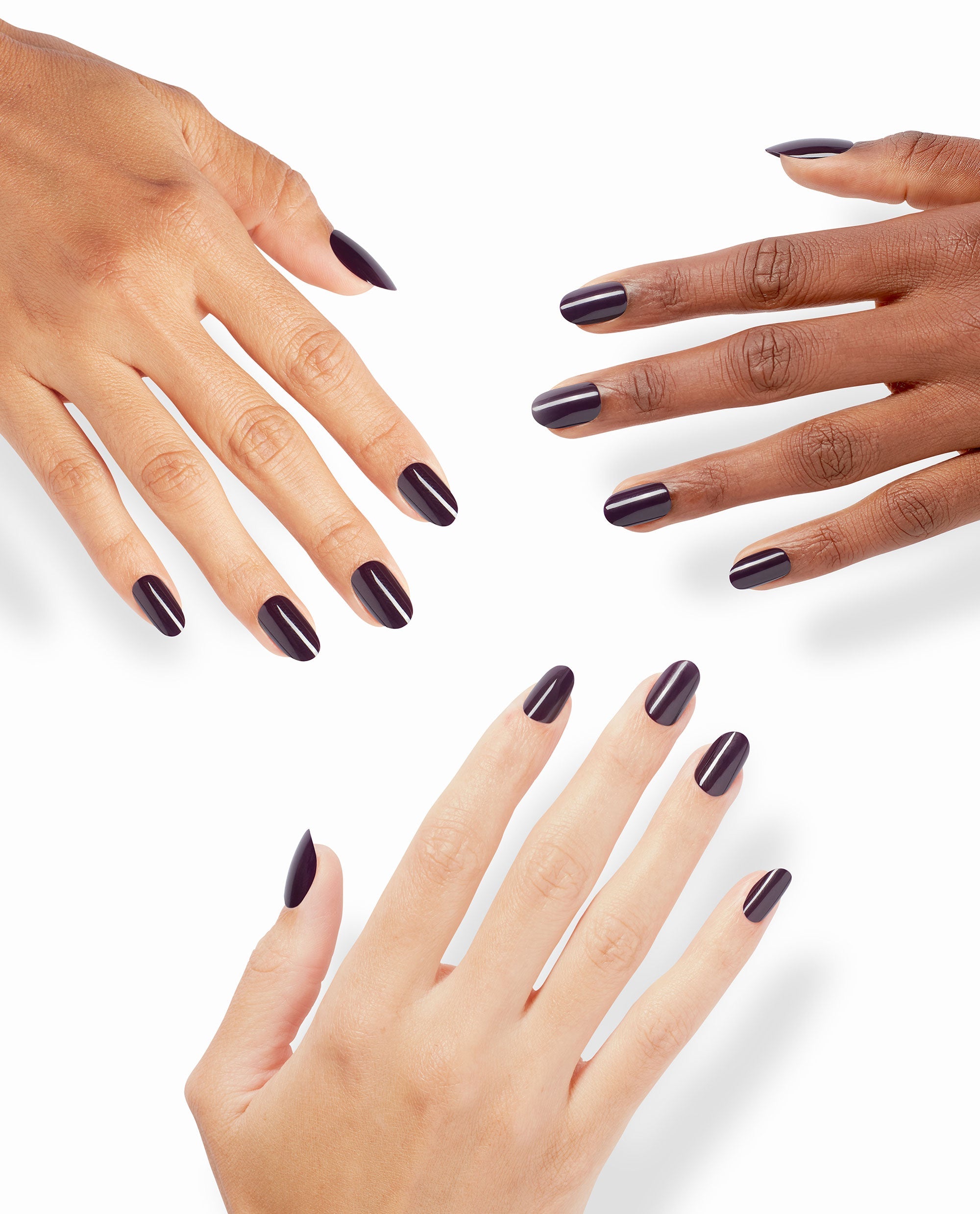 Hands with glossy dark plum O Suzi Mio On Point nails pose on a white background, showcasing an OPI-inspired shade for rich fall nail colors.
