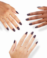 Hands with glossy dark plum O Suzi Mio On Point nails pose on a white background, showcasing an OPI-inspired shade for rich fall nail colors.