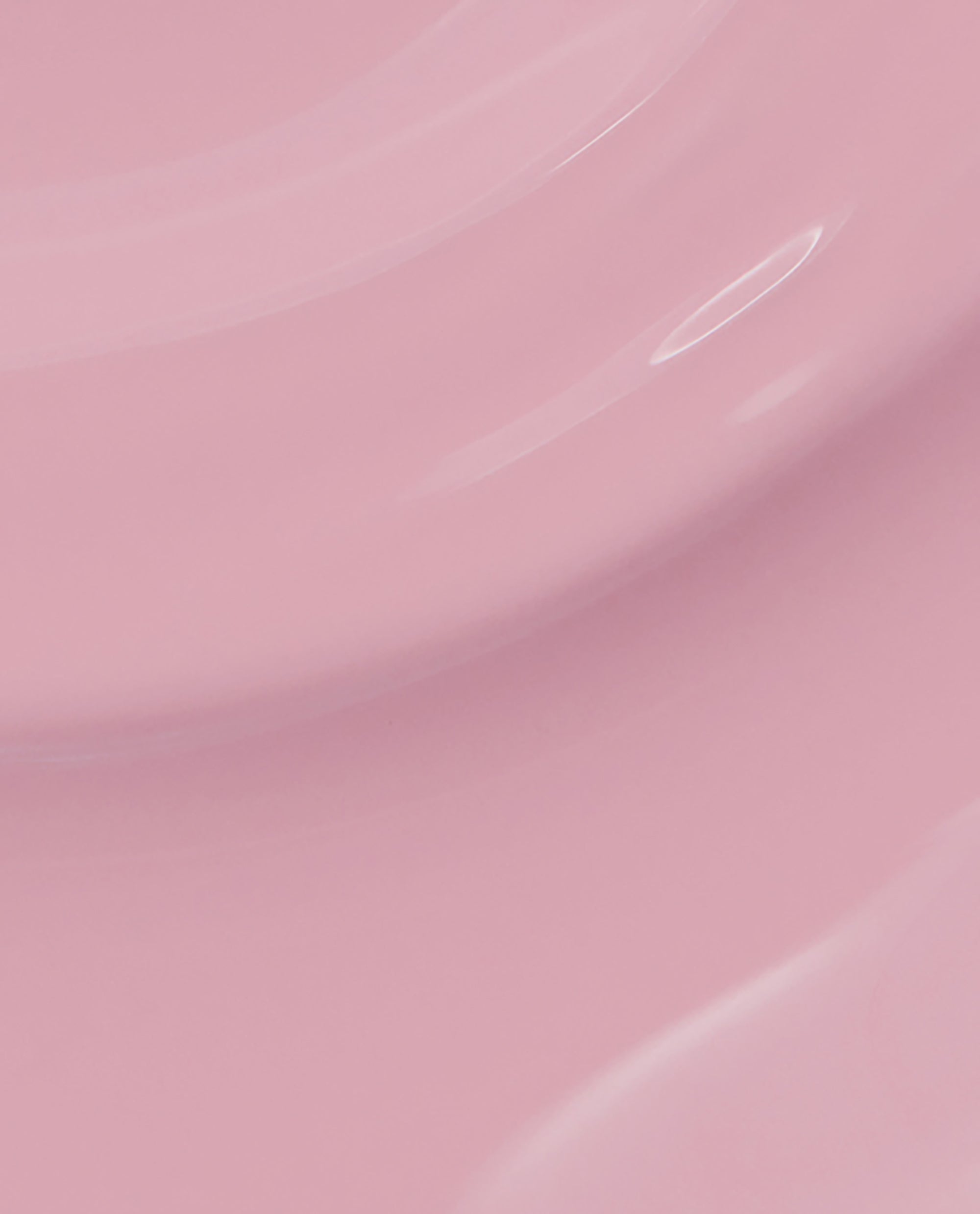 Glossy swirls of soft pastel pink (P)Ink on Canvas nail lacquer create smooth, curved layers, showcasing the creamy finish and color payoff of this OPI nail polish close-up.