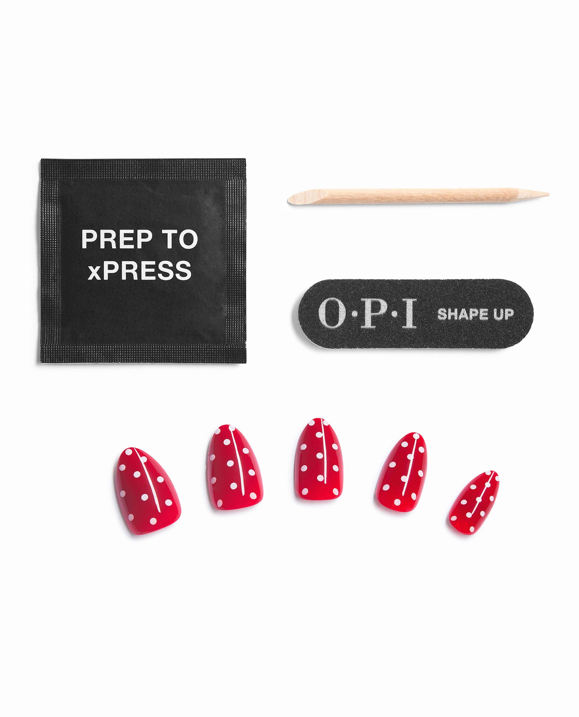 OPI Polka Dot Com Sticking Point press-on nail kit showcases glossy red fall nail colors with white polka dots, plus prep pad, cuticle stick, and OPI Shape Up file on white.