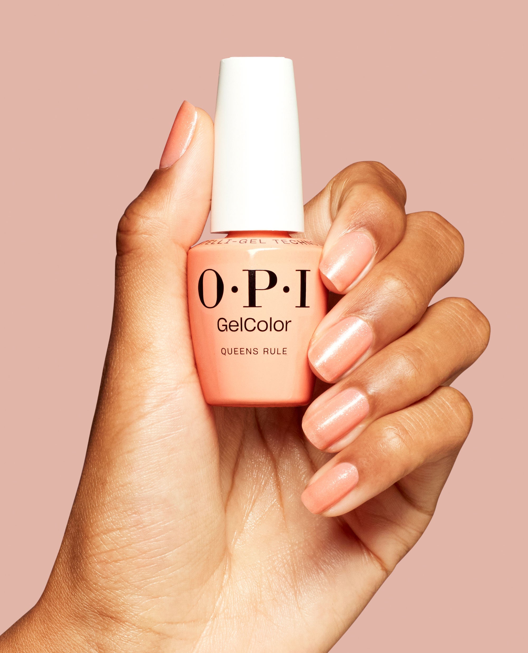 Queens Rule Peach Shimmer Gel Nail Polish Hand and Product