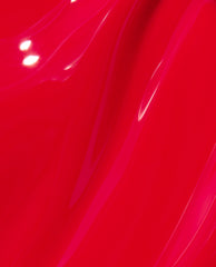 Glossy swipe of OPI nail polish in Red Heads Ahead nail lacquer, showing smooth, high-shine bright red color with subtle streaks and reflections across the liquid surface