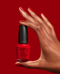 Red Velvet Vixen Red Nail Polish Hand and Bottle