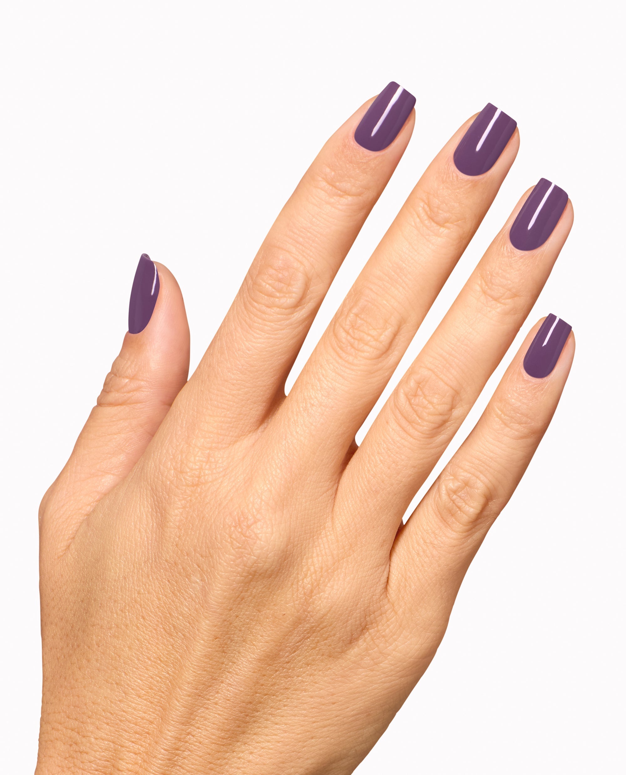 Hand displays a glossy deep purple manicure with OPI Reign or Shine Infinite Shine polish, a rich shade for fall nail colors, on a clean white background.