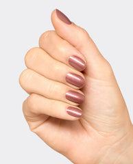 Hand modeling OPI Route Beer Float nail lacquer, a glossy metallic rosy brown manicure with shimmer, showcasing warm fall nail colors on short rounded nails against a light gray background.