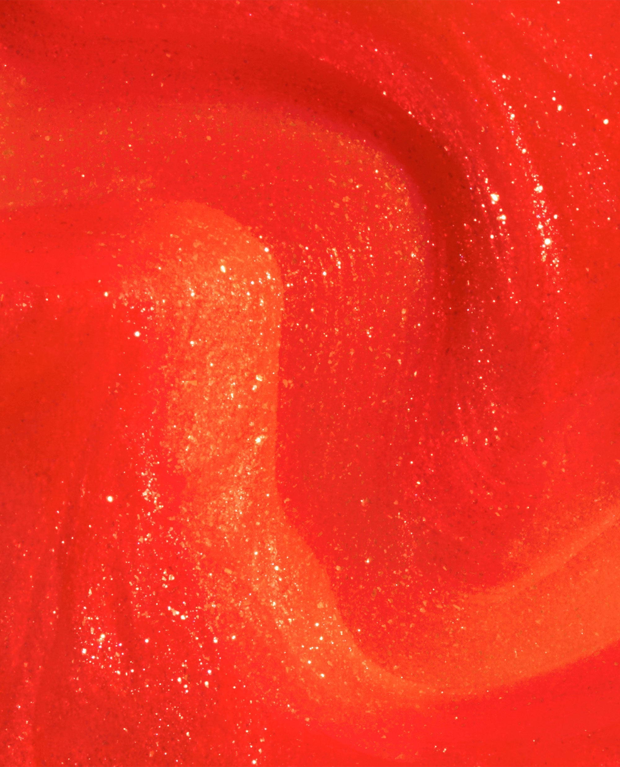 OPI Shock Em Orange Infinite Shine nail polish swatch shows a trending vivid orange-red gel-like lacquer with glossy shimmer and golden sparkle in a close-up texture.