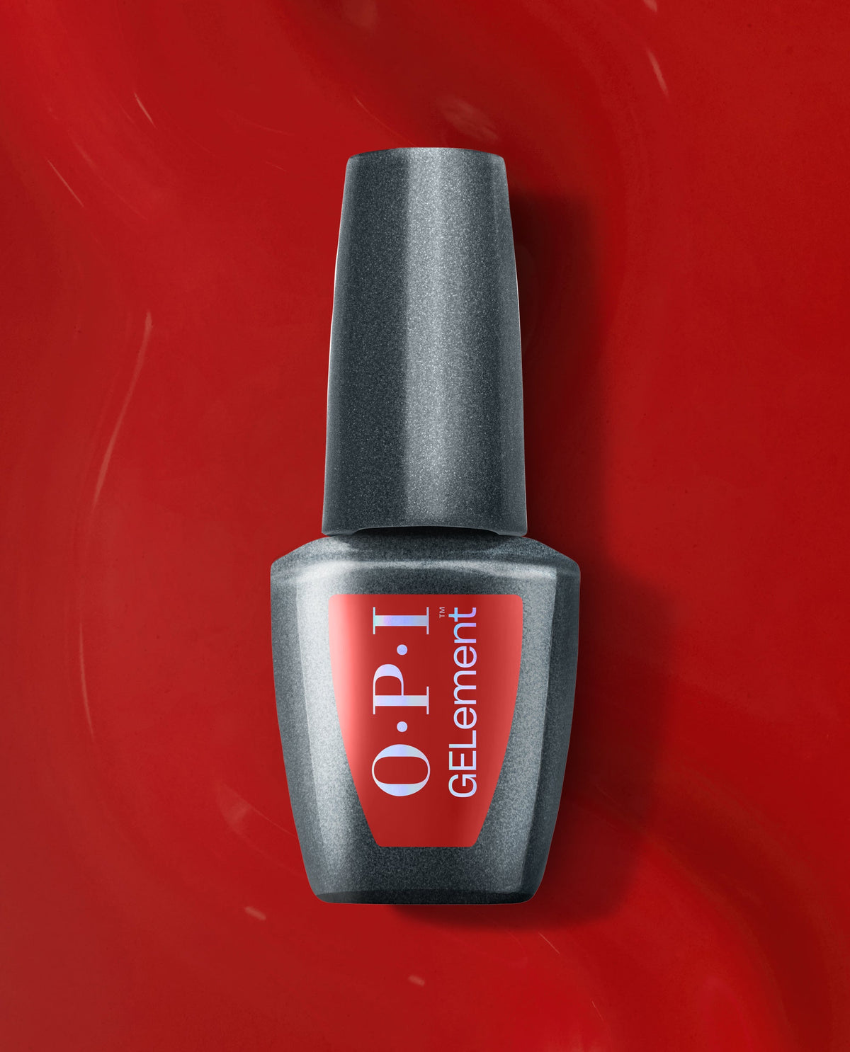 OPI GelColor Single & Red-y at-home gel nail polish bottle with a red label, centered on a glossy red polish background for bold fall nail colors.