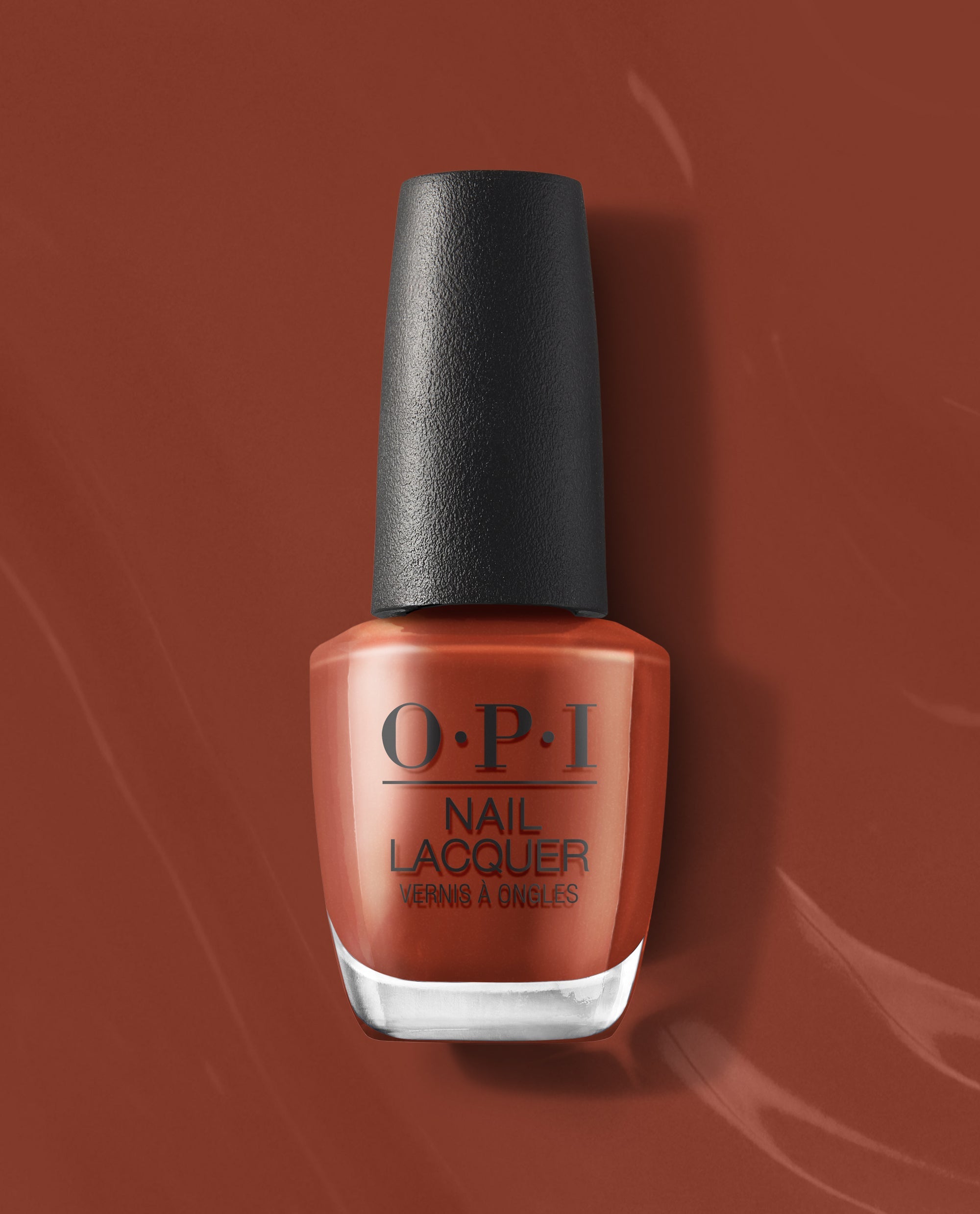 OPI Slip Dressed Up nail lacquer bottle in a warm terracotta brown shade with black cap, shown on a matching glossy background for fall nail colors.