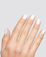 Hand with neatly manicured nails painted in Snow AnGEL opaque white at-home gel nail polish, shown against a light gray background to highlight glossy salon-quality coverage, ideal for OPI, nail polish gift set shoppers seeking crisp white nails.