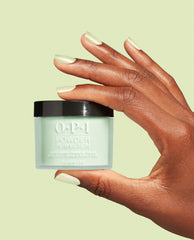 OPI Powder Perfection AppointMINT Confirmed dipping powder jar held between manicured fingers on a mint backdrop, showcasing a soft green nail polish ideal for spring nail colors; OPI 1.5 oz container with black lid.