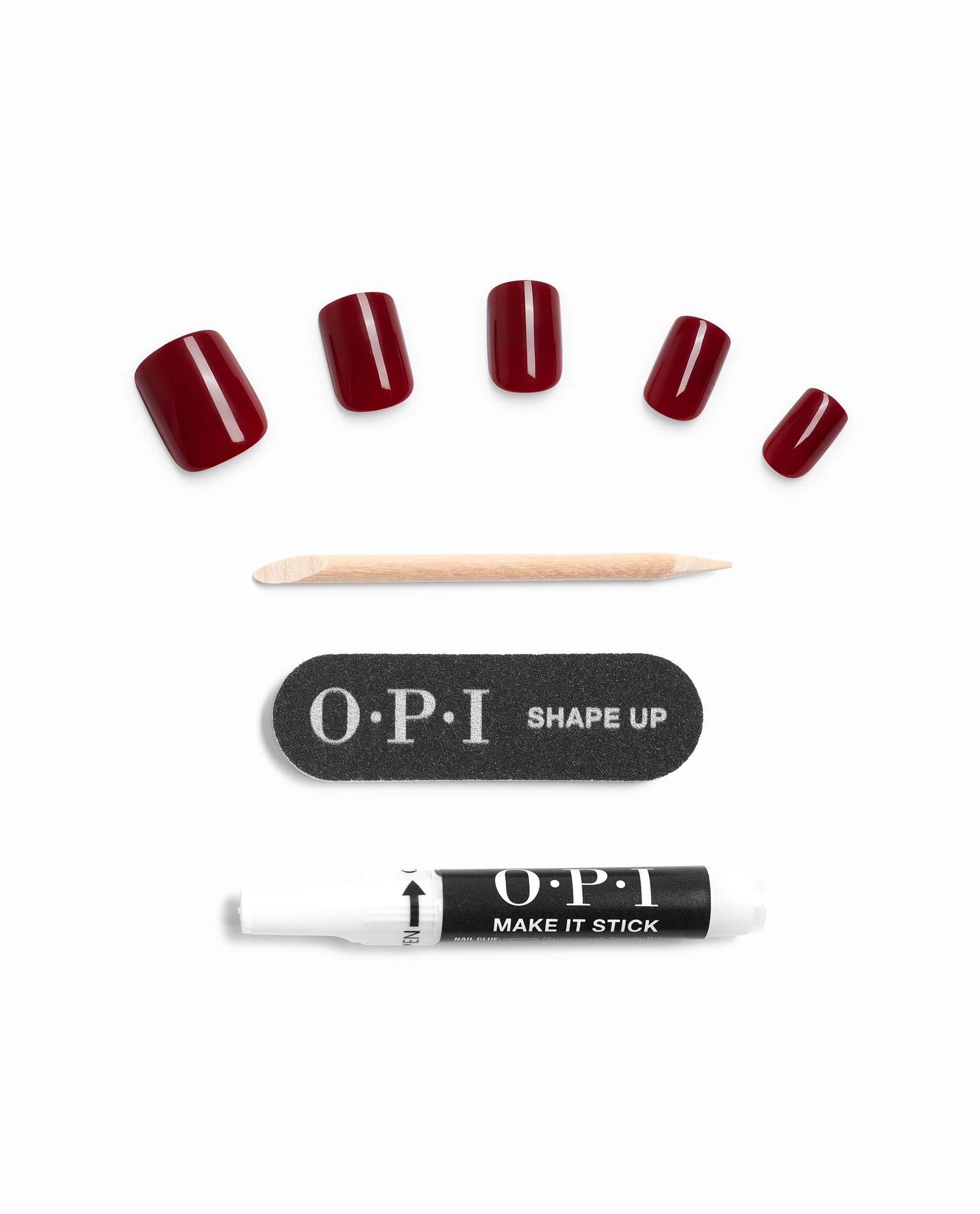 OPI On Point Como se Llama? glossy deep red press-on nails are arranged with a wooden cuticle stick, Shape Up nail file, and Make It Stick glue on a white background, showcasing rich fall nail colors.