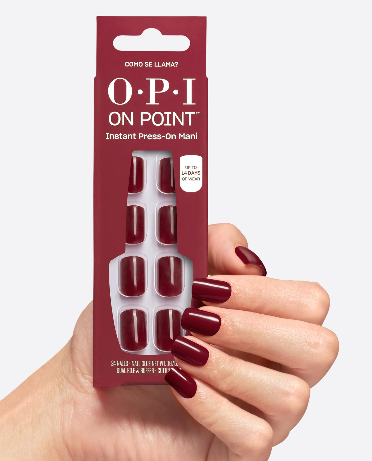 A hand with glossy deep burgundy nails holds OPI On Point Como se Llama? instant press-on mani pack, showing matching square nails and up to 14 days wear on a white studio background, ideal for fall nail colors.