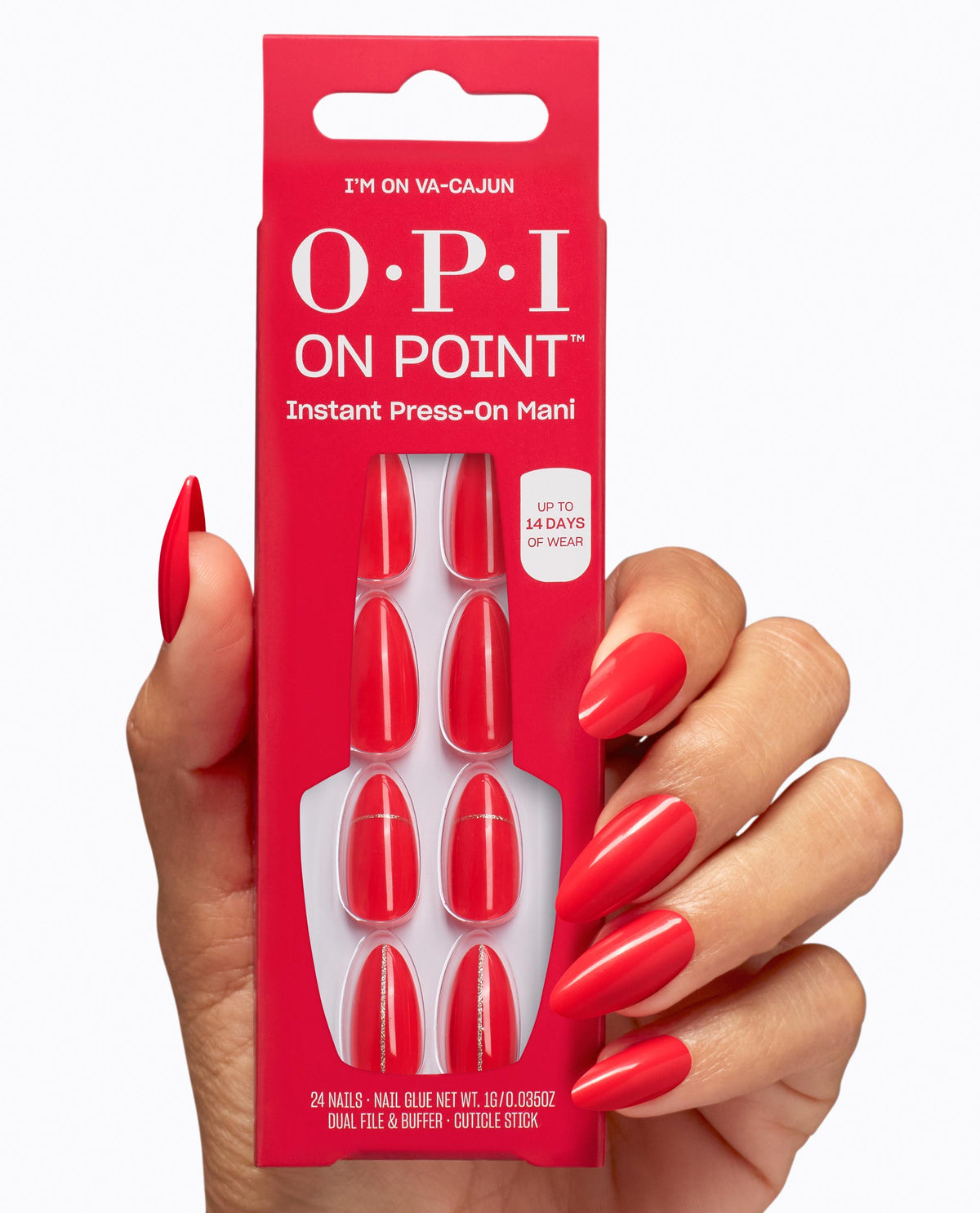 Hand with glossy red almond nails holds OPI On Point I’m on Va-Cajun instant press-on mani pack, showing matching red nails with subtle gold line accents.