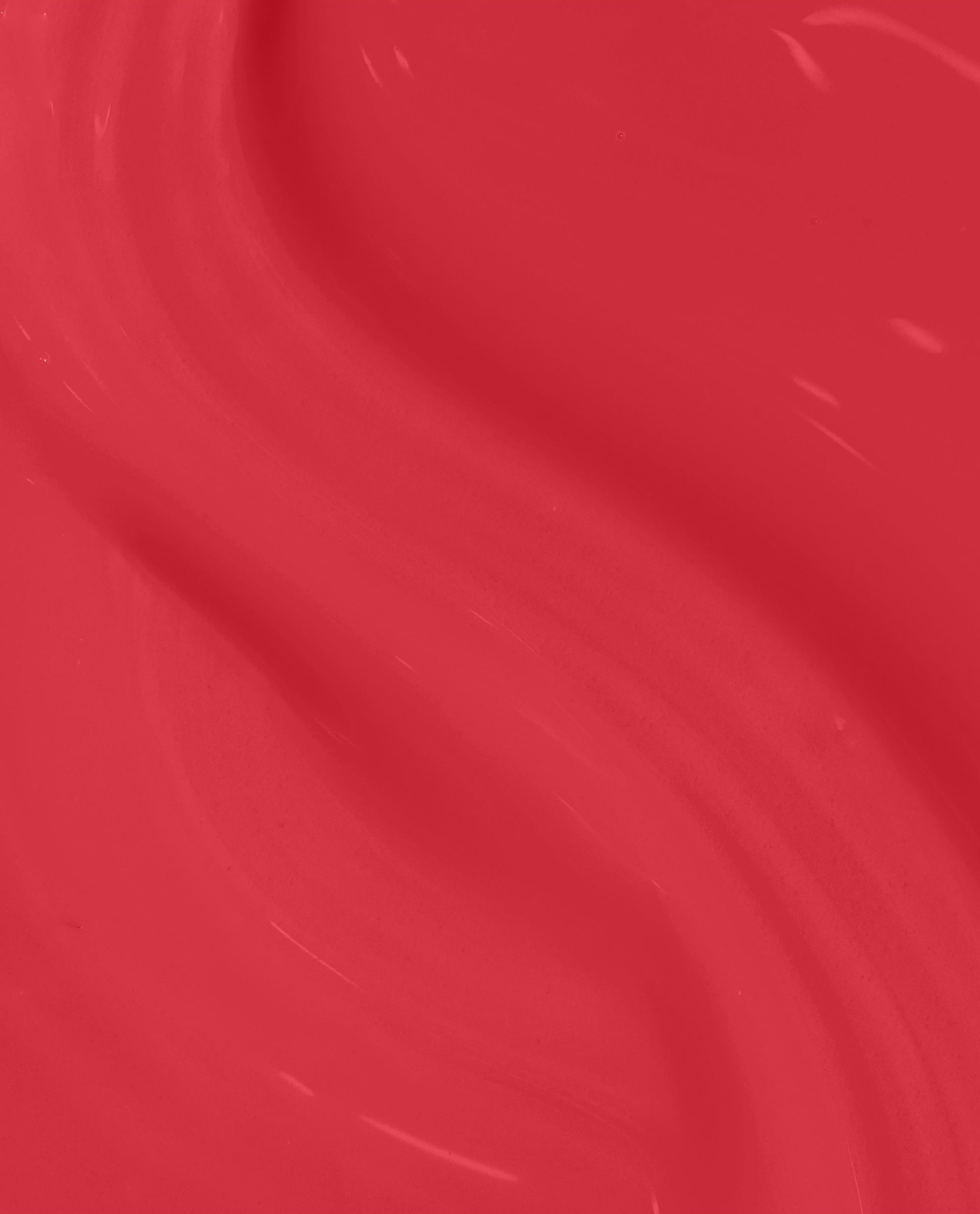 Special O-Cajun at-home gel nail polish swatch shows a glossy Cajun coral-red OPI trending shade with a smooth, reflective finish in a close-up texture view.