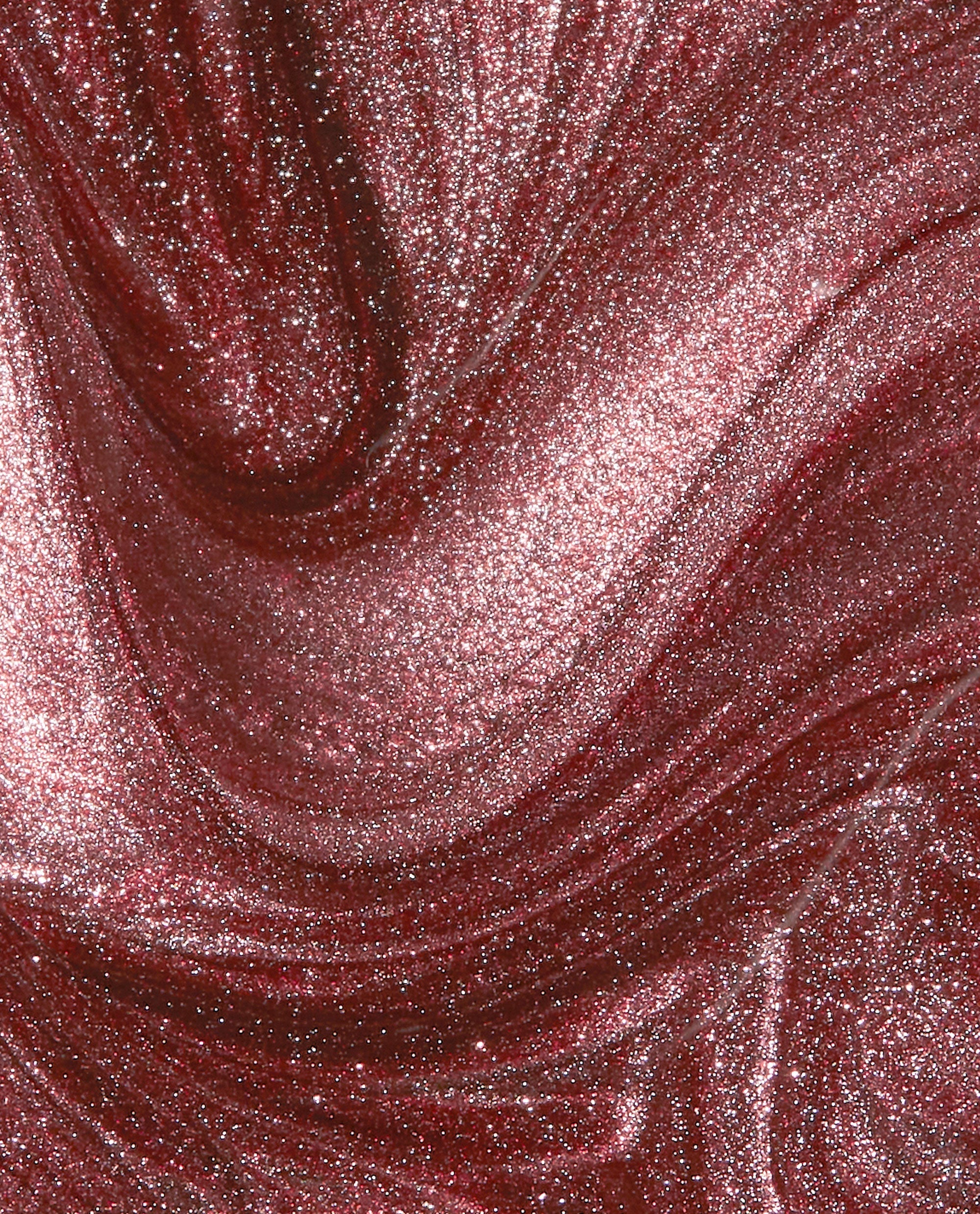Stellar Tips Infinite Shine OPI nail polish swirling in a close-up liquid texture, showing a rich rose-gold base packed with fine metallic glitter and shimmer for a high-shine, sparkling manicure finish.
