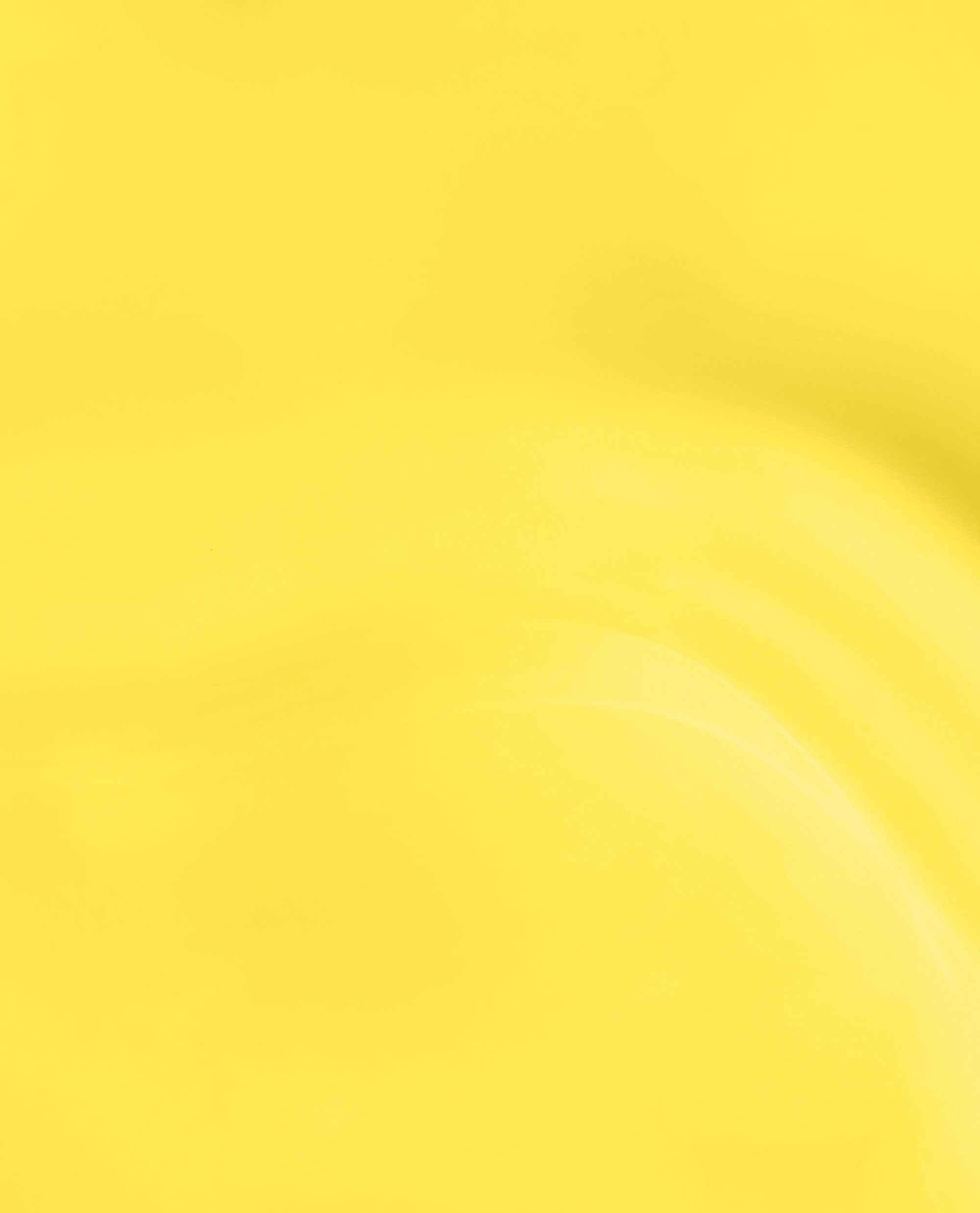 OPI Infinite Shine Sunkissed and Tell nail polish swatch shows a glossy, sunlit yellow shade with smooth curved highlights on a full-frame lacquer background.