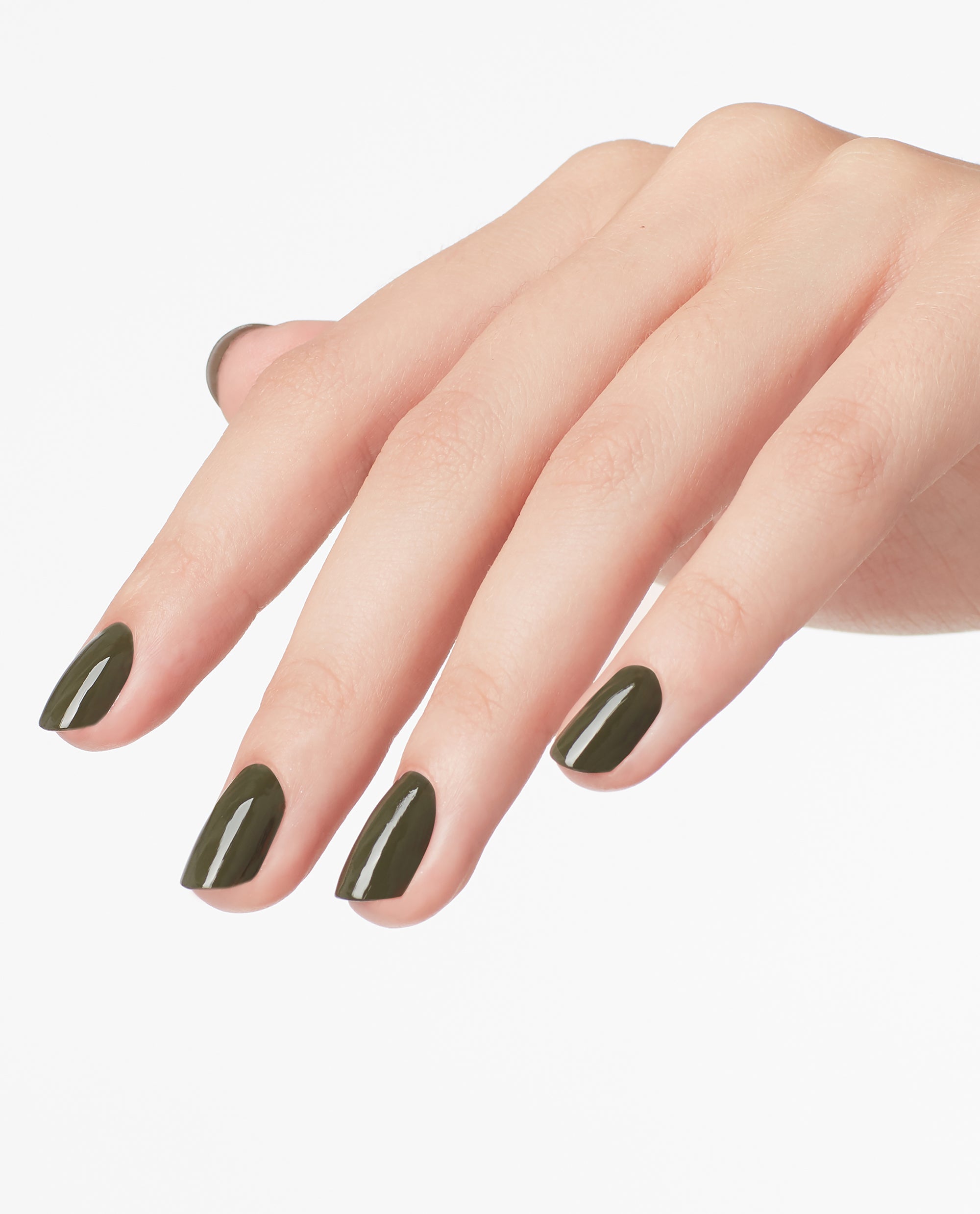 Hand showcasing glossy olive green manicure painted with Suzi - The First Lady of Nails Gel Nail Polish by OPI, a deep moss shade ideal for green nail polish fans and trending spring nail colors, on almond-shaped nails against a white background.
