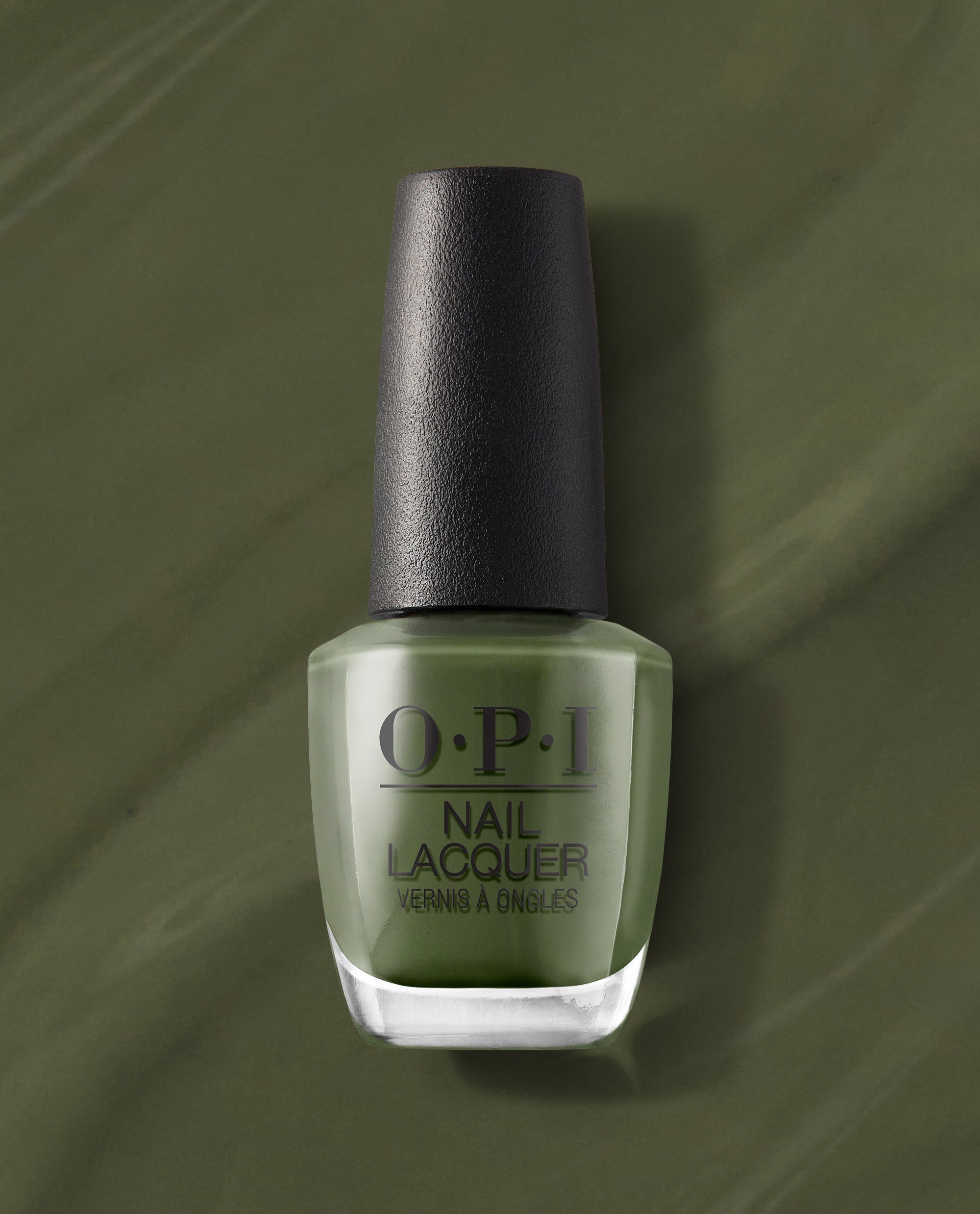 OPI Suzi – The First Lady of Nails Nail Lacquer bottle standing upright, showcasing a rich olive green nail polish against a matching swirled backdrop, a chic pick for spring nail colors from OPI with frosted glass and a textured black cap.
