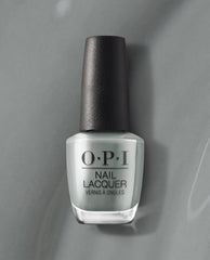OPI nail polish bottle of Suzi Talks with Her Hands nail lacquer standing upright, showcasing its cool gray shade and black cap against a matching gray background for a modern, minimalist product display.