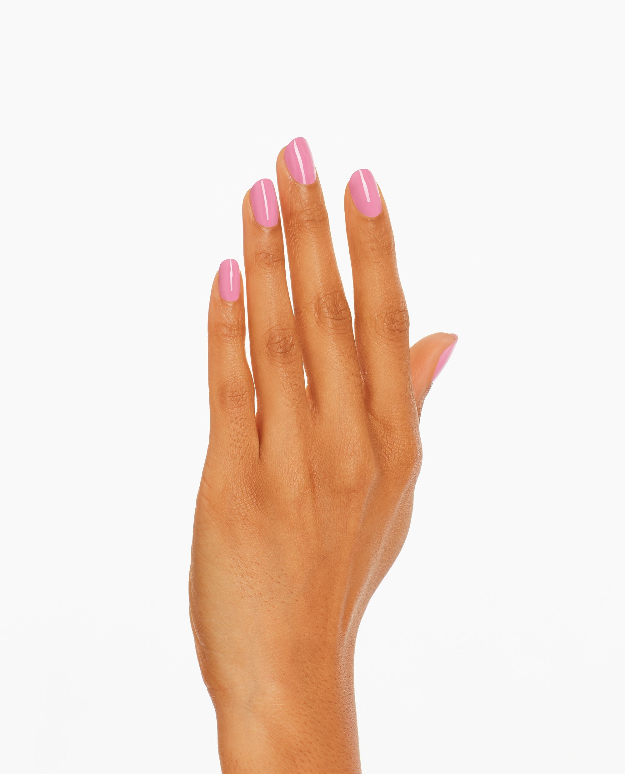 Hand with neatly manicured nails shows Suzi Will Quechua Later! OPI nail polish, a glossy medium pink nail lacquer shade, against a clean white background for a modern, salon-quality look.