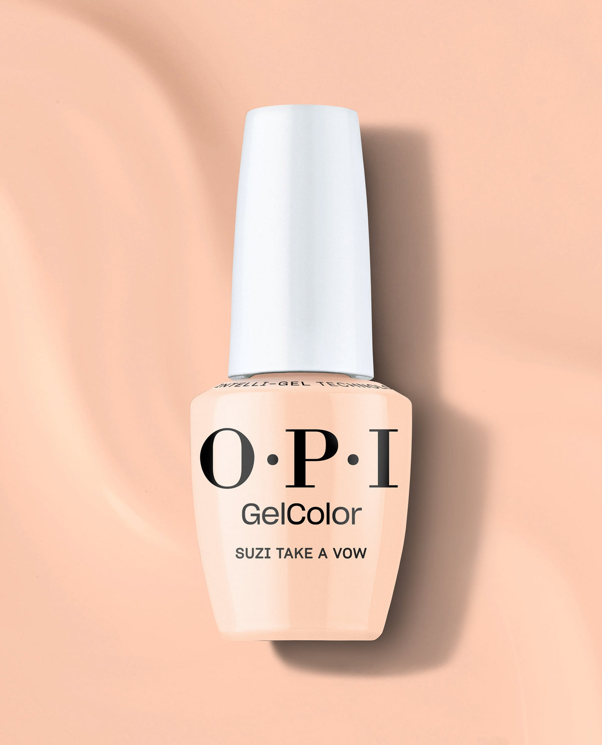 OPI GelColor Suzi Take a Vow gel nail polish bottle in a soft peachy nude shade with a white cap, standing on a peach background for elegant fall nail colors.