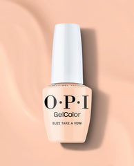 OPI GelColor Suzi Take a Vow gel nail polish bottle in a soft peachy nude shade with a white cap, standing on a peach background for elegant fall nail colors.