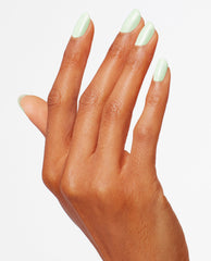 Mint pastel nails showcase OPI That's Hula-rious! Nail Lacquer, a glossy green nail polish, on a model's hand posed against a white studio background, highlighting fresh spring nail colors and a smooth, even mani.