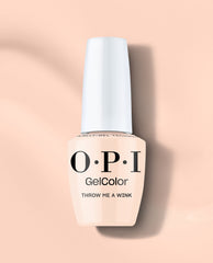 OPI GelColor Throw Me a Wink gel nail polish bottle in a soft pale peach nude shade with a white cap, displayed on a peach background for subtle fall nail colors.